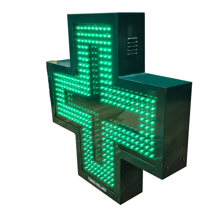 Green LED lighted pharmacy cross on a white background